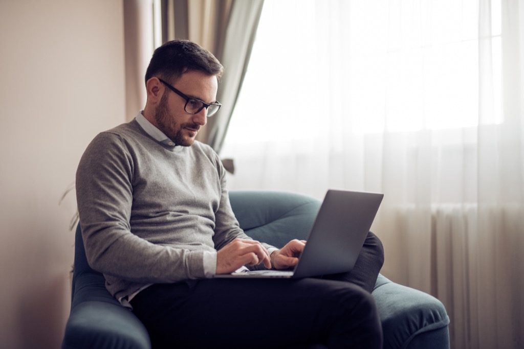 man-with-laptop-in-chair.jpg
